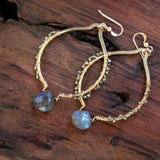 labradorite and pyrite big gold earrings on wood table