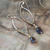 gold wirewrapped earrings  on wooden table