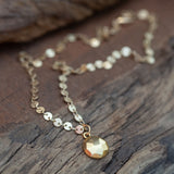 gold disc necklace with faceted gold coin