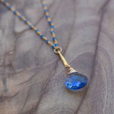 healing crystal necklace for spiritual transformation with tanzanite and blue chalecdony 