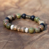 Men’s grounding bracelet with unakite, picture jasper, black stone, buri wood beads, and vintage vinyl spacers in earthy masculine tones