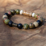 Men’s grounding bracelet with unakite, picture jasper, black stone, buri wood beads, and vintage vinyl spacers in earthy masculine tones