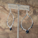 "I Am Empowered" Black Spinel Oval Silver Earrings hanging beautifully.