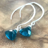 Trillion cut faceted peacock blue quartz earrings on sterling silver hooks, minimalist elegant gemstone jewelry with deep ocean tones.