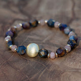 Siritual bracelet for grounding and feminine energy with tiger eye  and peach moonstone. gives strength clarity and emotional healing gemstones