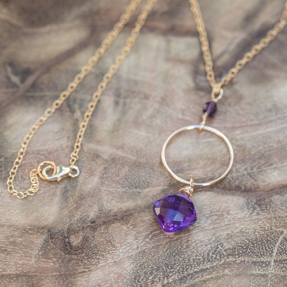 Amethyst energy healing necklace elegantly displayed, showcasing its vibrant purple hues and intricate design.