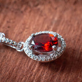 Confidence and Strength: Garnet and Diamond Halo Style Necklace