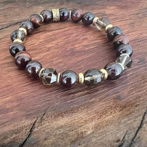 chakra balancing womens bracelet with garnet, tiger eye and smoky qwwquartz