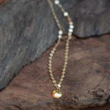gold circlur disc necklace for abundance