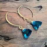 gold v-style earrings with blue quartz
